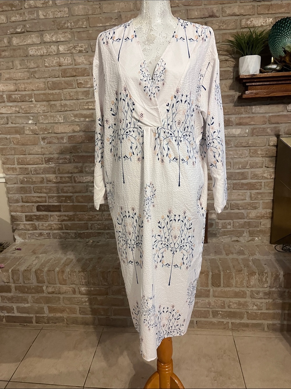 White Floral V-Neck Midi Dress with floral print. This dress has pockets!